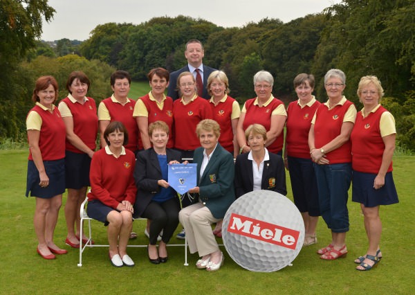 Vonnie Noonan (ILGU Board Member) presenting Ann Treacy (Lady Captain, Tuam Golf Club) with the 2014 Miele All Ireland Ladies Interclub Fourball Regional Final pennant after their victory at Athlone Golf Club. Also in the picture in front are Catherine Canavan (Team Manager) and Lily O'Sullivan (Lady Captain, Athlone Golf Club). At back (from left) Jacqui McGrath, Jackie Cullen, Annete O'Neill, Martina Casserly, Lorna Mullally, Pat McGrath (Miele Ireland), Siobhan Joyce, Mary Bollard, Mary McDonagh, Mary Roche and Ann Higgins. Picture by Pat Cashman