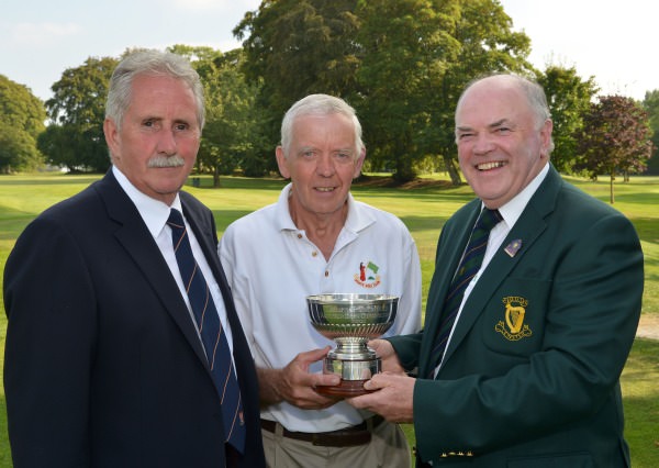 Joe McNamara (Hon Treasurer, Leinster Golf, GUI) presenting Bert Burke (Moate) with the 2014 Leinster Veterans Amateur Open Championship trophy after his victory at Athy Golf Club (10/09/2014). Also in the picture is Tom Myers (Captain, Athy Golf Club). Picture by Pat Cashman
