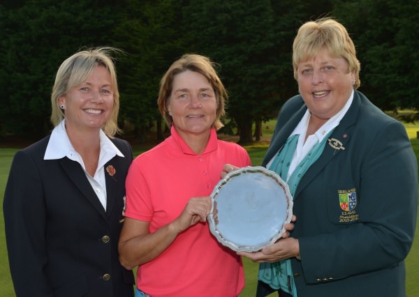Mary McKenna (President, Irish Ladies Golf Union) presenting Minna Kaarnalahti (Finland) with the 2014 Irish Senior Women's Open Strokeplay trophy after her victory at Dundalk Golf Club (12/09/2014). Also in the picture is Anne Doohan (Lady Captain, Dundalk Golf Club). Picture by Pat Cashman