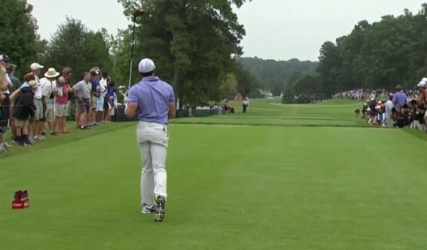 Rory McIlroy watches his drive sail right on the ninth. 