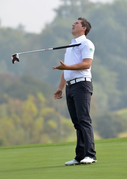 Colm Campbell (Warrenpoint) reacts to a missed putt on the 18th green in the semi final of the AIG Barton Shield at Carton House today (17/09/2014). Picture by Pat Cashman