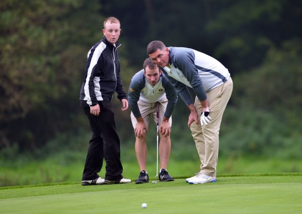Evan Talty and Mervin Hehir (Spanish Point) with caddy Declan Talty lining up their putt at the 14th iin the final of the AIG Pierce Purcell Shield at Carton House (19/09/2014). Pat Cashman