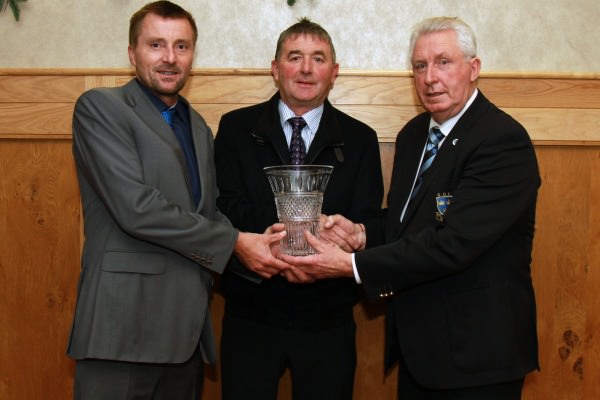 Ger Keane of Keanes Jewellers Cork (sponsor) presents Richie Hurley (Gary Hurley’s father) with the 2014 Munster Senior Golfer of the Year Award. Also pictured, John Moloughney, Chairman GUI Munster Branch