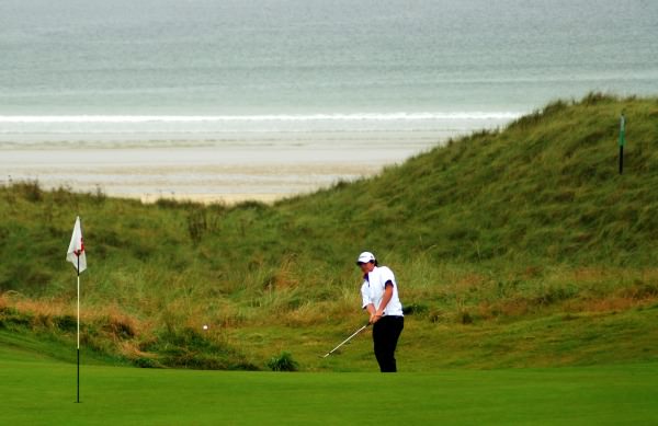 A young Rory McIlroy chipping at Rosapenna