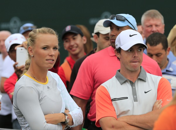 Caroline Wozniacki and Rory McIlroy wait on the 17th tee during the final round of the 2014 Omega Dubai Desert Classic. 2nd February 2014. Picture: Eoin Clarke www.golffile.ie