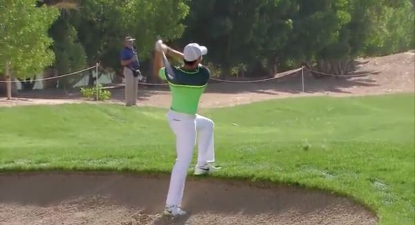 Rory McIlroy got up and down for birdie from an awkward lie on the third, above, to kickstart his round in Abu Dhabi.