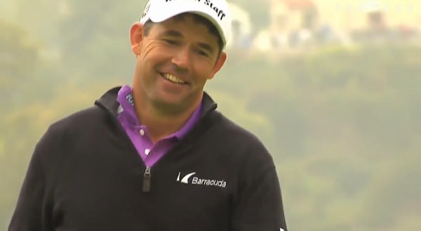 Pádraig Harrington smiles wryly after his eagle putt lips out at the first. 