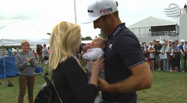 Dustin Johnson celebrates with his wife and child