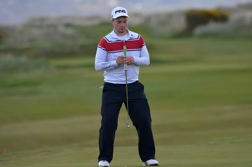 Jack Hume (Naas) gets a feel for the line of his putt at The Royal Dublin Golf Club. Picture by Pat Cashman