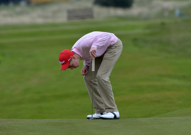 Kevin LeBlanc (The Island) looking at the line of his putt on the 4th green in the third round of the 2015 Irish Amateur Open Championship at The Royal Dublin Golf Club. Picture by Pat Cashman