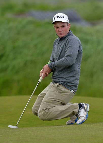 Jack Hume (Naas) watching his birdie putt on the 3rd green in the third round. P icture by Pat Cashman