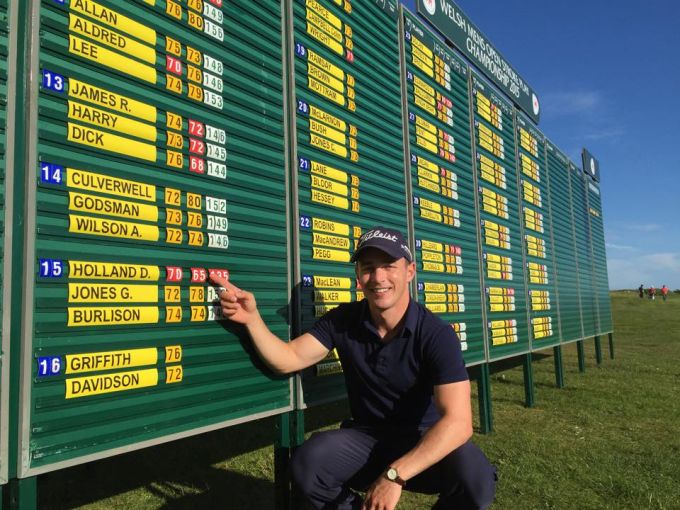 Daniel Holland points to his course record in Wales