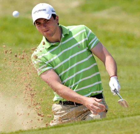 Reeve Whitson splashes out of a bunker in the 2012 Interpros at Royal County Down. Picture by Pat Cashman