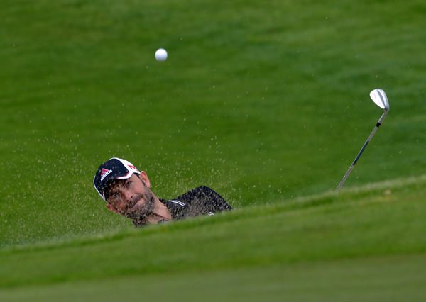 Dave O'Donovan (Muskerry) blasting from the bunker at the 18th. Picture by Pat Cashman