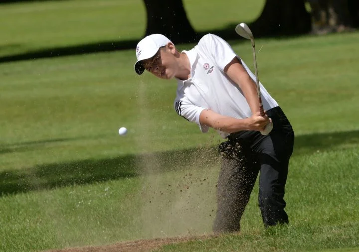 Winner of the Under 17 trophy Oliver Clarke (England) coming from the bunker at the 11th green in the final round of the Irish Boys Amateur Open Championship. Picture by Pat Cashman
