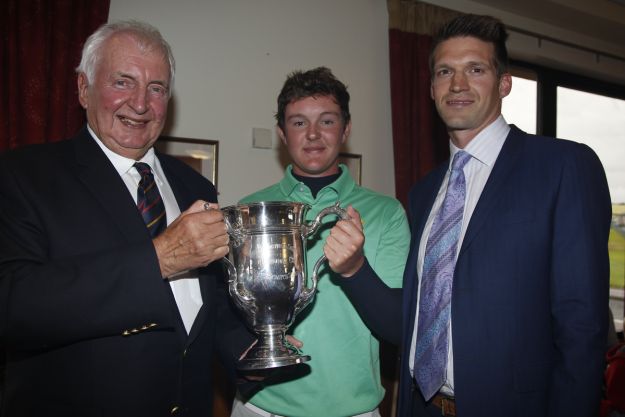 Peter Sinclair (President Ulster Branch G.U.I) and Andrew Spence (Cathedral Eye Clinic - Sponsor) presents the Harriman Cup to John-Ross Galbraith (Whitehead) on winning the North of Ireland Amateur Open Championship at Royal Portrush, Dunluce Course on Friday 17th July 2015. Picture: Golffile | Thos Caffrey