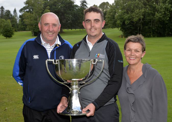 Alan Lowry, flanked by his parents Brendan and Brigid, with the 2015 Mullingar Electrical Scratch Trophy. 