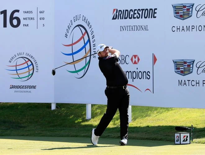 Shane Lowry drives on the par-five 16th at Firestone's South Course on Friday. Picture: Getty Images