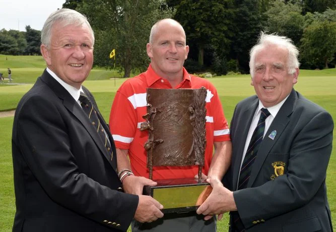 John Ferriter (Chairman, Leinster Golf, GUI) presenting Alan Condren (Greystones) with the 2015 Leinster Mid Amateur Open Championship trophy after his victory at Grange Golf Club (08/08/2015). Also in the picture is Paul Muldowney (Captain, Grange …
