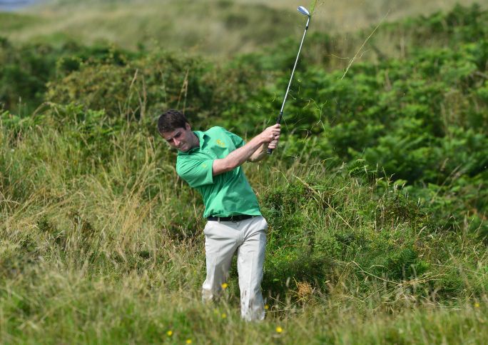 Dermot McElroy (Ireland) playing from the rough at the 9th hole during the second day of the 2015 Home International Matches. Picture by Pat Cashman