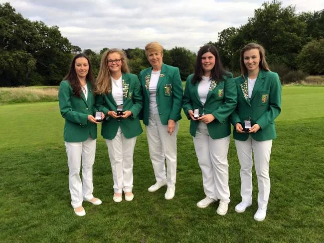 New caps (left to right) Sarah Helly (Enniscrone), Annabel Wilson (Lurgan), Niamh McSherry (Lurgan) and Julie McCarthy (Forrest Little) with ILGU President Valerie Hassett (centre) at Royal Wimbledon.