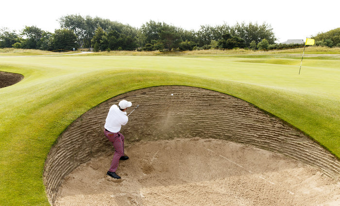 Denny McCarthy blasts out of a greenside bunker on the sixth hole during a practice round ahead of the 2015 Walker Cup at Royal Lytham & St. Annes G.C. in Lytham St Annes, Lancashire on Friday, Sept. 11, 2015. (Copyright USGA/John Mummert)