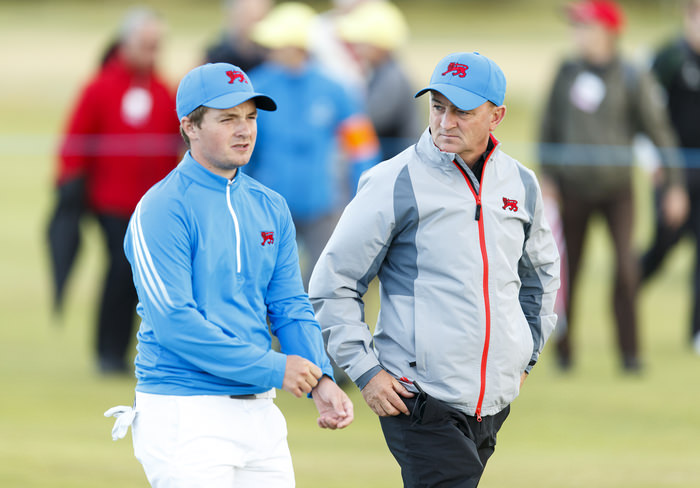 Captain Nigel Edwards, right, and Jack Hume, left, walk down the 18th hole during an afternoon singles match at the 2015 Walker Cup at Royal Lytham & St. Annes G.C. in Lytham St Annes, Lancashire on Saturday, Sept. 12, 2015. (Copyright USGA/Chris Keane)