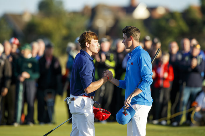 Robby Shelton, left, shakes hands with Gary Hurley, right, on the 18th hole during an afternoon singles match at the 2015 Walker Cup at Royal Lytham & St. Annes G.C. in Lytham St Annes, Lancashire on Saturday, Sept. 12, 2015. (Copyright USGA/John Mummert)