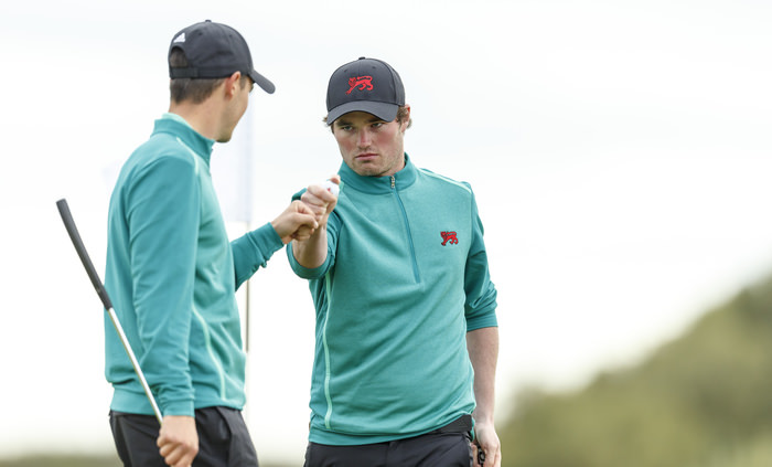 Cormac Sharvin, right, fist bumps with Jack McDonald, right, after winning the sixth hole during a morning foursomes match at the 2015 Walker Cup at Royal Lytham & St. Annes G.C. in Lytham St Annes, Lancashire on Sunday, Sept. 13, 2015. (Copyright USGA/Chris Keane)