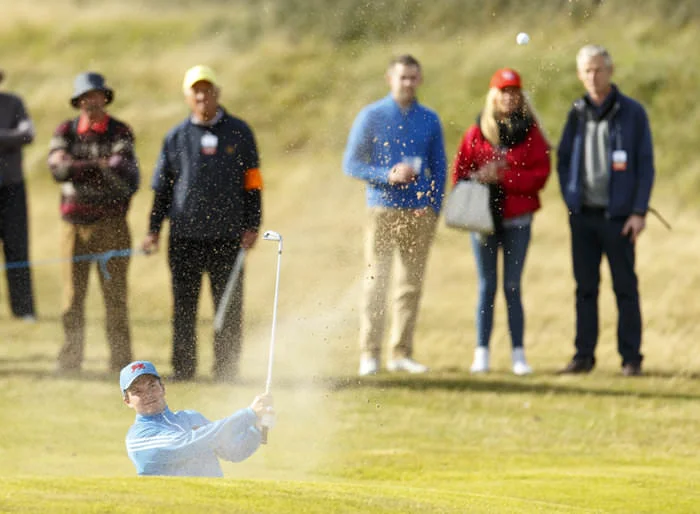 Jack Hume blasts out of a bunker on the seventh hole during an afternoon singles match at the 2015 Walker Cup at Royal Lytham & St. Annes. (Copyright USGA/Chris Keane)