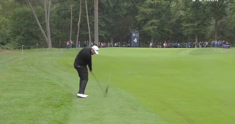 Shane Lowry stripes another iron shot into one of Woburn's soft greens.