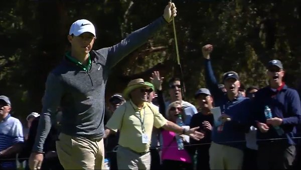 Rory McIlroy salutes the crowd after holing a huge putt on the third