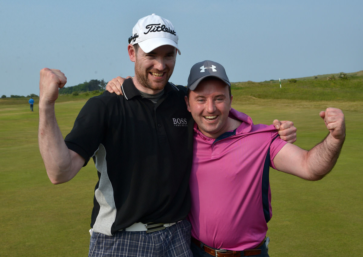 Paul O'Hanlon (Carton House) celebrates with his caddy Richie Whelan on the 18th green after his victory in the CityNorth Hotel sponsored East of Ireland Championship. Picture by Pat Cashman