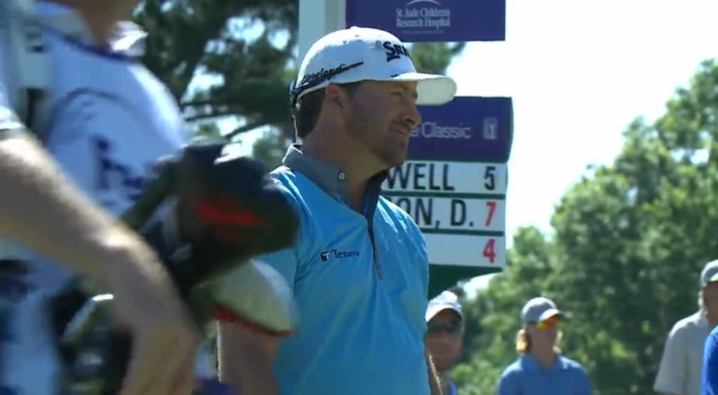 a resigned looking Graeme McDowell after his stroke of bad luck on the 14th