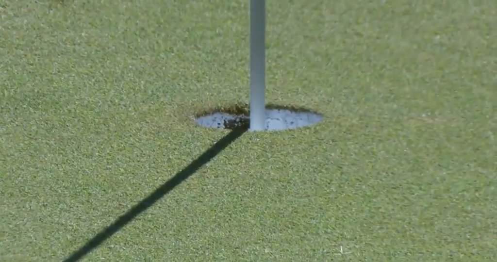 McDowell's tee shot at the 14th damaged the inside of the cup.