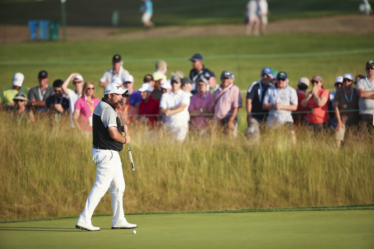Shane Lowry bites his putter after missing a par putt on the 14th hole during the final round of the 2016 U.S. Open at Oakmont Country Club in Oakmont, Pa. on Sunday, June 19, 2016. (Copyright USGA/Darren Carroll)