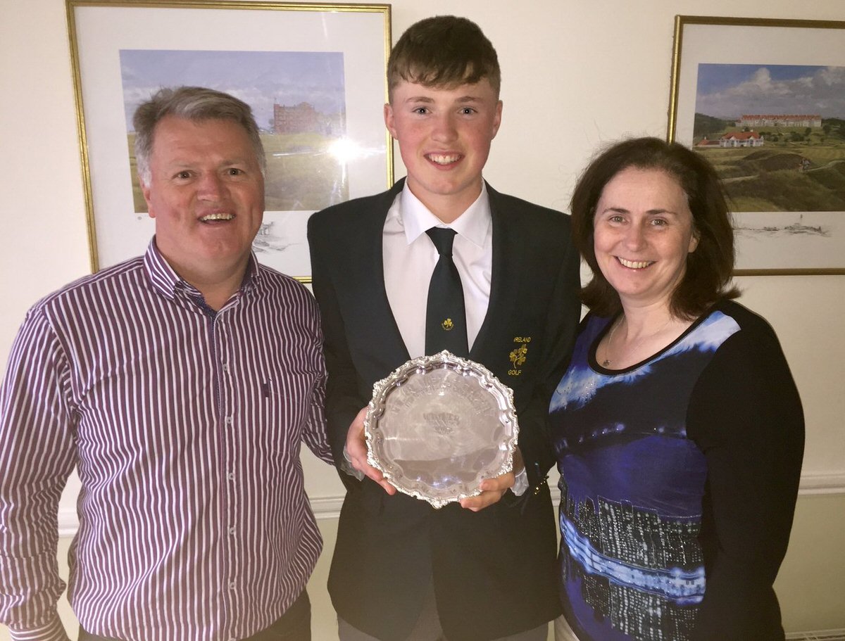 Mark Power shows off the Peter McEvoy Trophy with his parents Eddie and Eileen Rose, both three time former Irish Amateur Close champions. Picture, courtesy Eddie Power