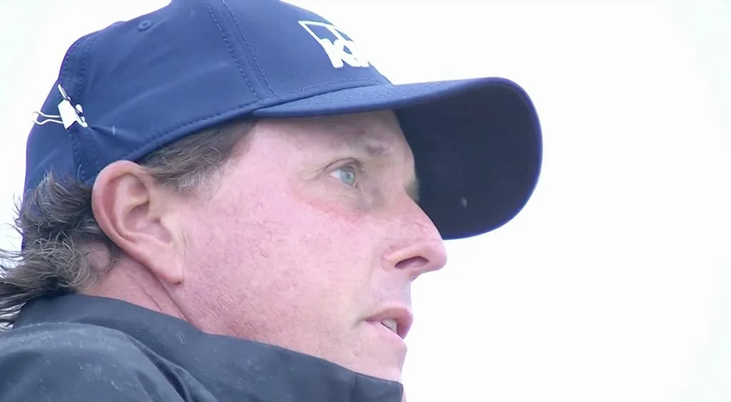 Phil Mickelson with his anti-wind clip on his cap