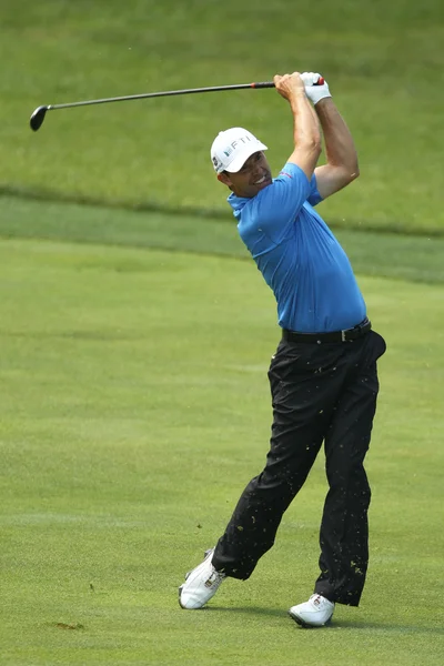 Slow start for Harrington in rain hit Travelers