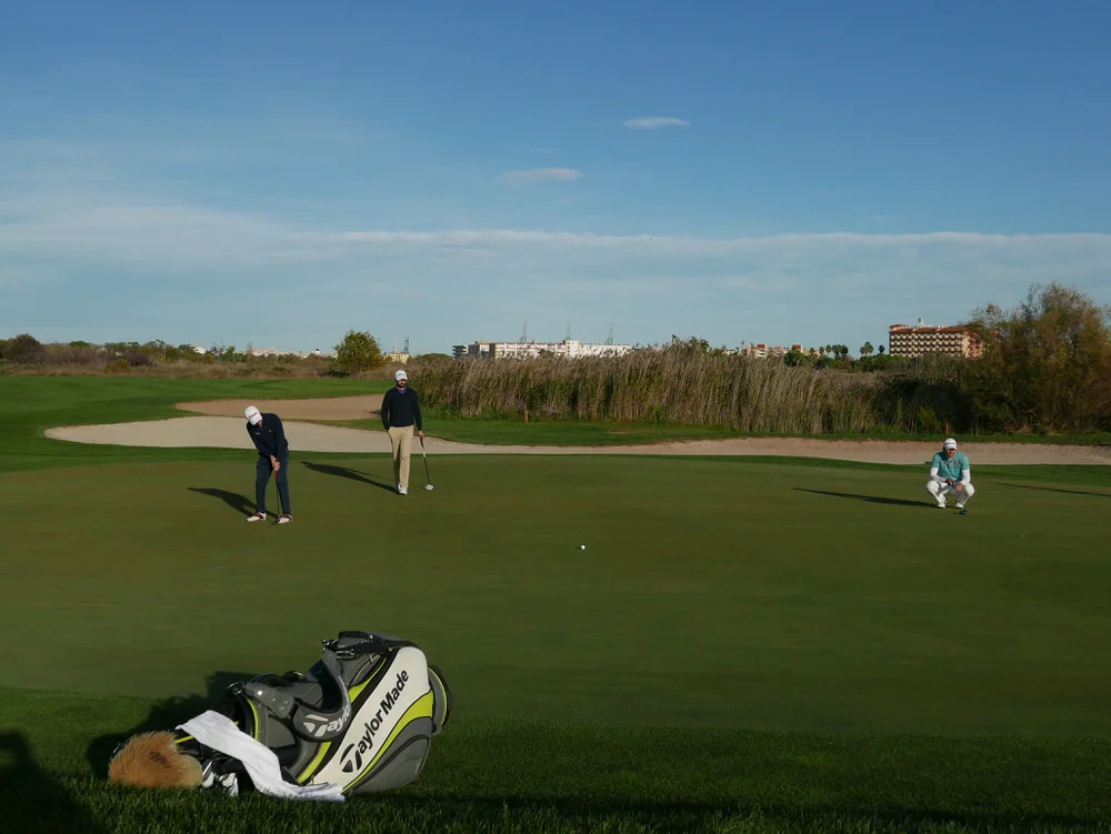 Ruaidhri McGee looks closely as Dermot McElroy narrowly misses for birdie on the ninth. Picture © Brian Keogh&nbsp;