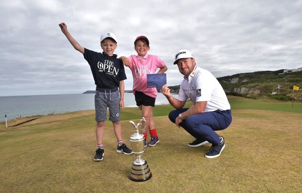 PORTRUSH, NORTHERN IRELAND - JULY 09: Graeme McDowell, Major Champion and Mastercard Global Ambassador, returned to Royal Portrush Golf Club along with Charlotte Beatt and Josh Ervine to mark the going on sale of the first tickets to The 148th Open which will be held at the famous links from 14-21 July 2019 on July 9, 2018 in Portrush, Northern Ireland. Tickets are on sale through The One Club which is a free to join membership programme. Visit TheOpen.com/PortrushTickets for more information and save £5 on your order when paying with a Mastercard. (Photo by Charles McQuillan/R&A/R&A via Getty Images)