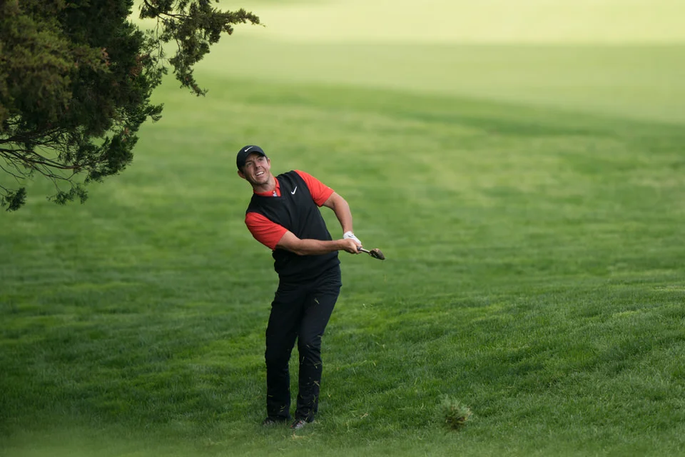 Rory McIlroy plays from the rough during the first round of the 101st PGA Championship. Photo by Darren Carroll/PGA of America