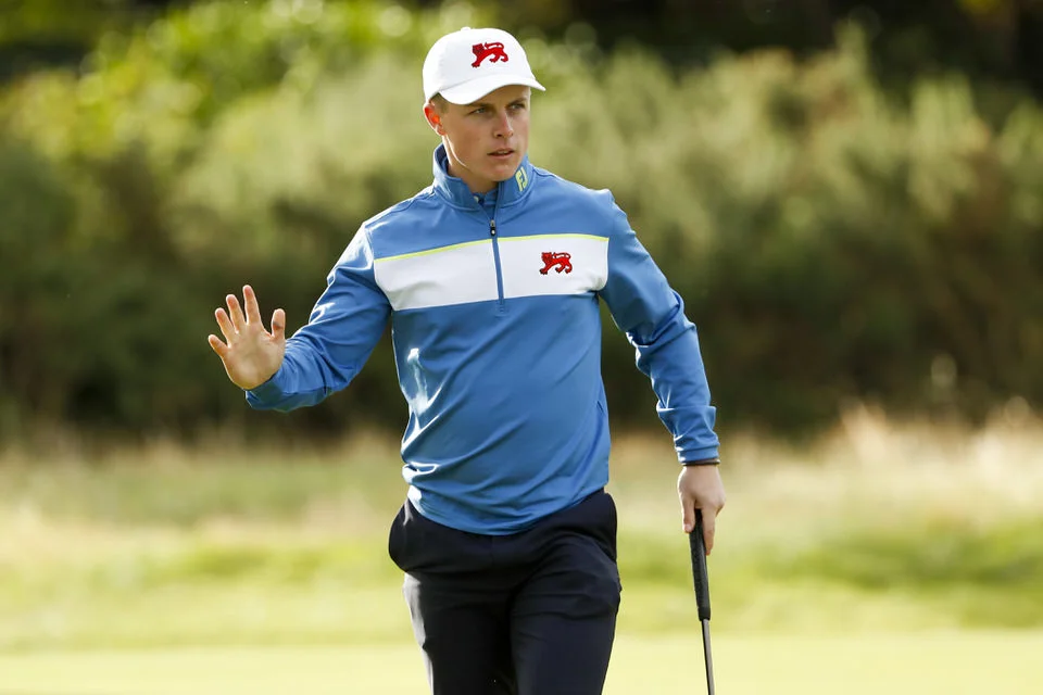 Conor Purcell waves after making his putt on the second hole during foursomes at the 2019 Walker Cup at Royal Liverpool in Hoylake, England on Saturday, Sept. 7, 2019. (Copyright USGA/Chris Keane)