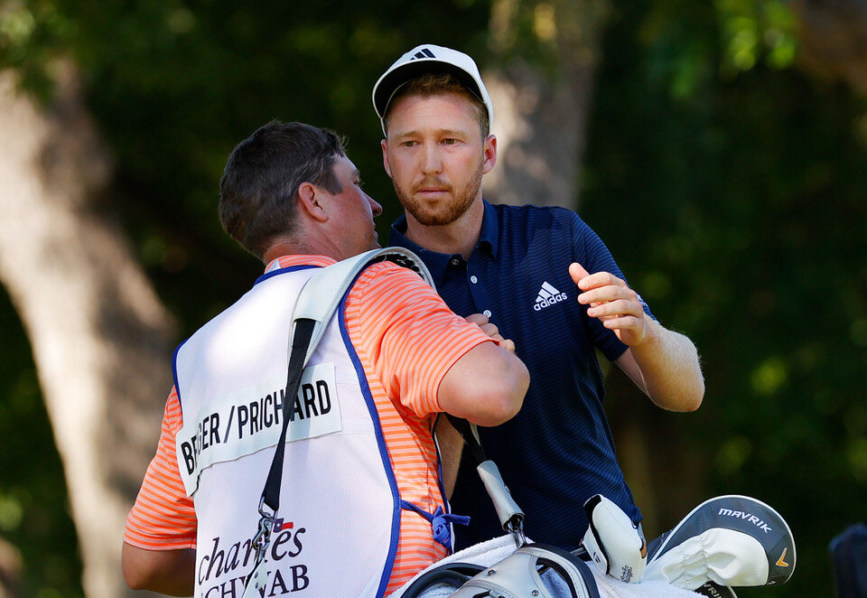  FORT WORTH, TEXAS - JUNE 14: Daniel Berger of the United States celebrates with his caddie on the 17th green after defeating Collin Morikawa of the United States during a playoff in the final round of the Charles Schwab Challenge on June 14, 2020 at