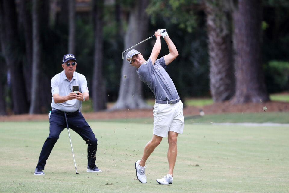  HILTON HEAD ISLAND, SOUTH CAROLINA - JUNE 17: Justin Thomas of the United States plays a shot as his father and coach Mike Thomas records his swing during a practice round prior to the RBC Heritage on June 17, 2020 at Harbour Town Golf Links in Hilt