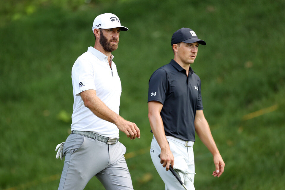  CROMWELL, CONNECTICUT - JUNE 25: Dustin Johnson of the United States and Jordan Spieth of the United States walk off the 15th tee box during the first round of the Travelers Championship at TPC River Highlands on June 25, 2020 in Cromwell, Connectic