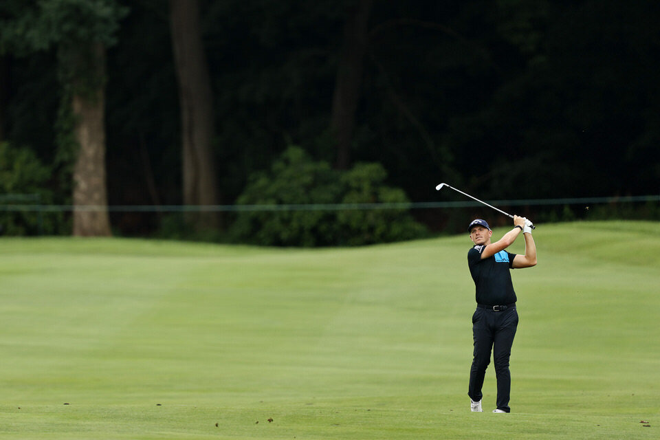  CROMWELL, CONNECTICUT - JUNE 26: Matt Wallace of England plays a shot on the fourth hole during the second round of the Travelers Championship at TPC River Highlands on June 26, 2020 in Cromwell, Connecticut. Wallace is playing alone after the other