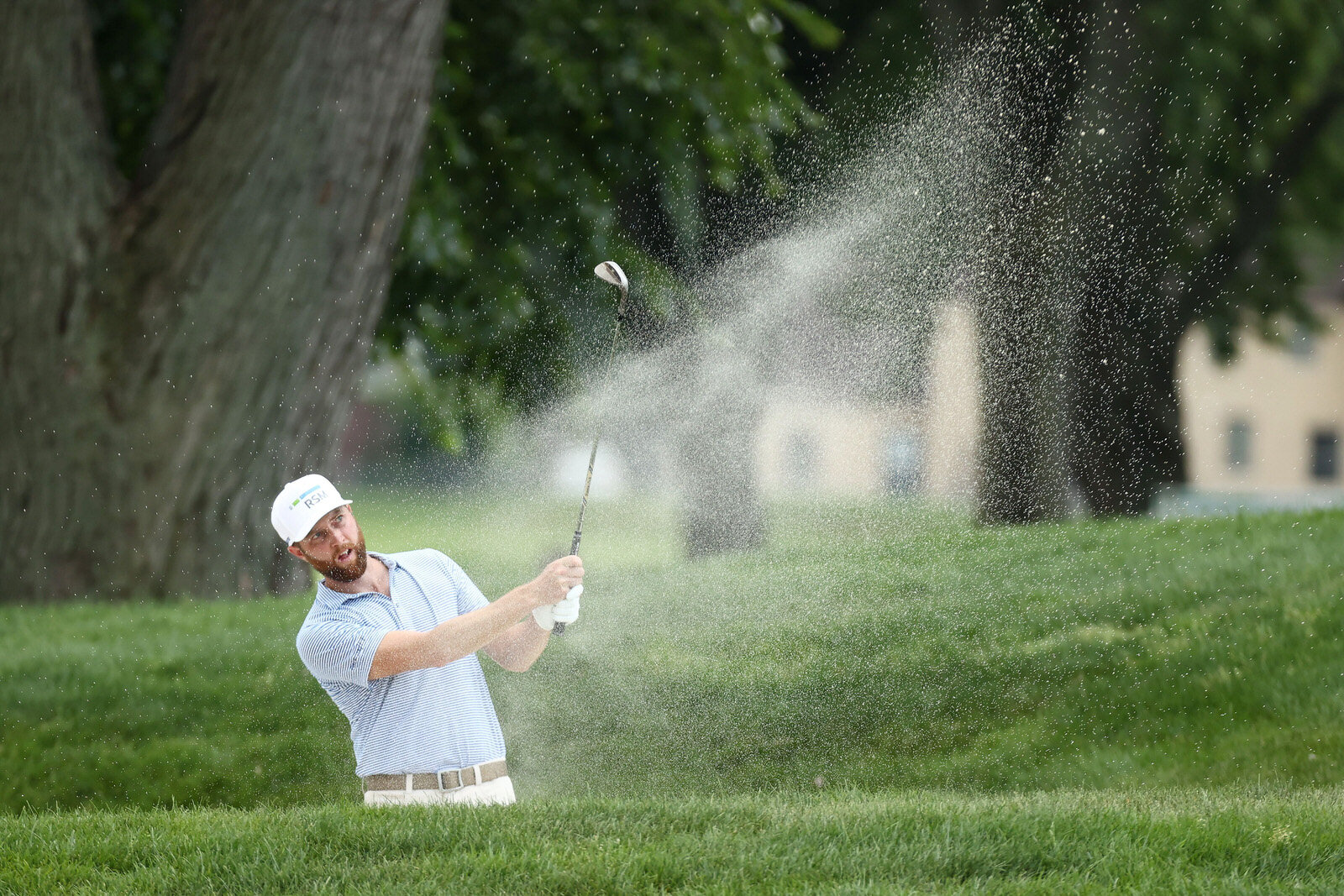  DETROIT, MICHIGAN - JULY 03: Chris Kirk of the United States plays a shot from a bunker on the 17th hole during the second round of the Rocket Mortgage Classic on July 03, 2020 at the Detroit Golf Club in Detroit, Michigan. (Photo by Gregory Shamus/