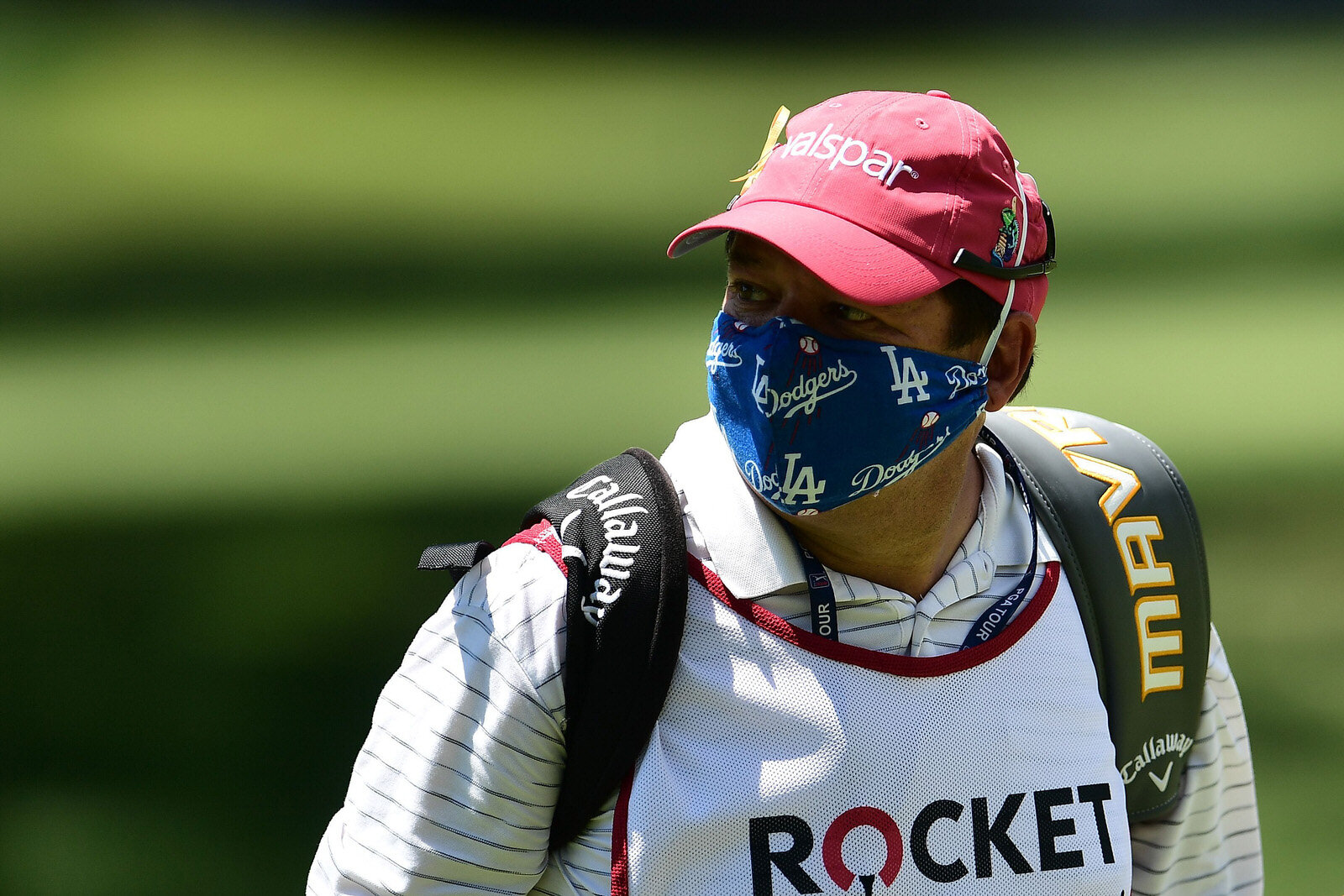  DETROIT, MICHIGAN - JULY 04:  Todd Montoya, caddie for Brian Stuard of the United States (not pictured), wears a mask during the third round of the Rocket Mortgage Classic on July 04, 2020 at the Detroit Golf Club in Detroit, Michigan. (Photo by Sta