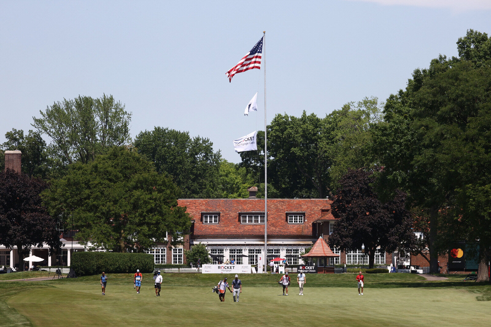  DETROIT, MICHIGAN - JULY 04: Webb Simpson of the United States and Chris Kirk of the United States walk on the third hole during the third round of the Rocket Mortgage Classic on July 04, 2020 at the Detroit Golf Club in Detroit, Michigan. (Photo by